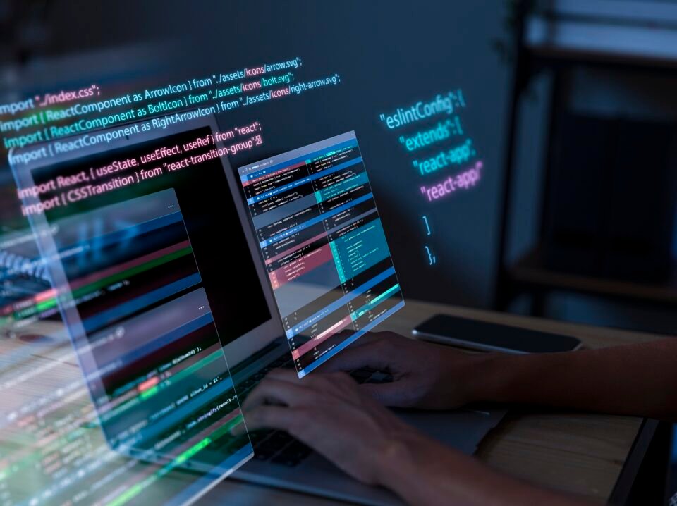 programming-background-with-person-working-with-codes-computer CapacitorJS